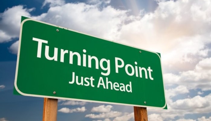 Turning point just ahead sign