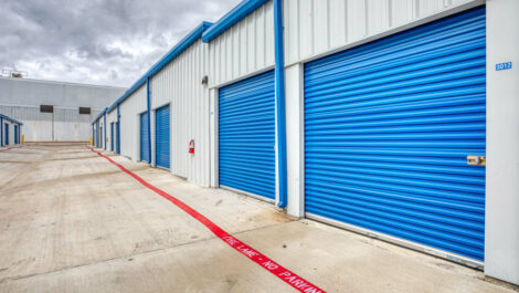 Large blue roll-up doors of our self storage units at Devon Self Storage in Fort Worth, Texas