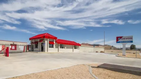 Exterior view of storage facility entrance with sign in West Apple Valley, CA, at Devon Self Storage - West Apple Valley