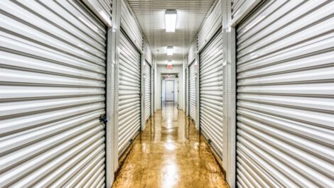 Walkway through climate-controlled storage units at Devon Self Storage in Greenville, Texas