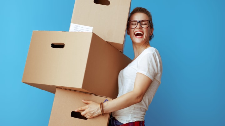 Woman holding storage boxes.