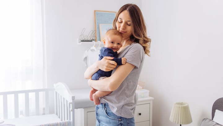 Woman holding baby.