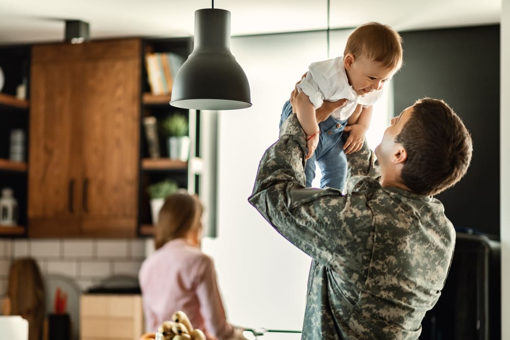 Military man returns home to his child.