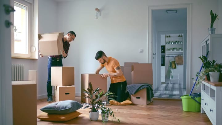 Men packing storage boxes.