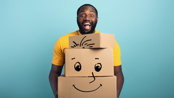 Man holding storage boxes.