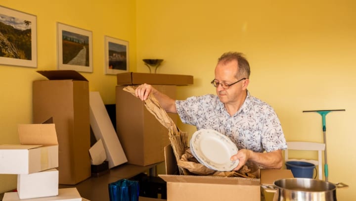 Man unpacking storage box.