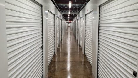Long hallway lined with storage units at Devon Self Storage in Orlando, Florida