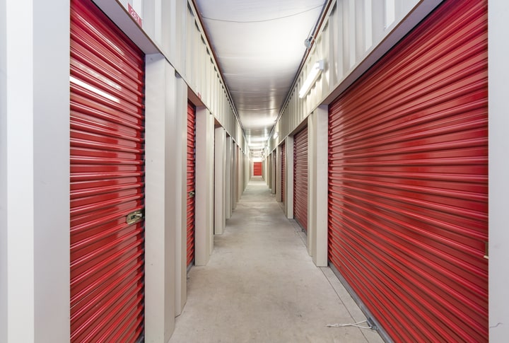 The indoor hallway of a storage facility.