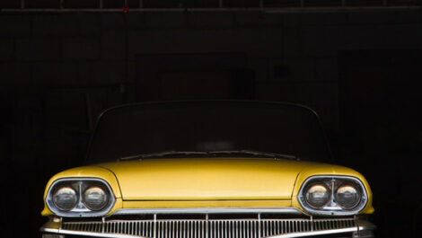 Yellow car inside a garage
