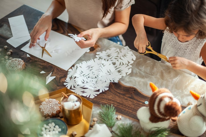 Family doing arts and crafts to decorate for the holiday season