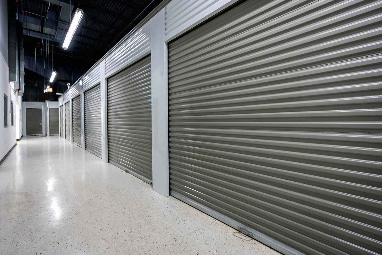 A storage facility with gray doors. 