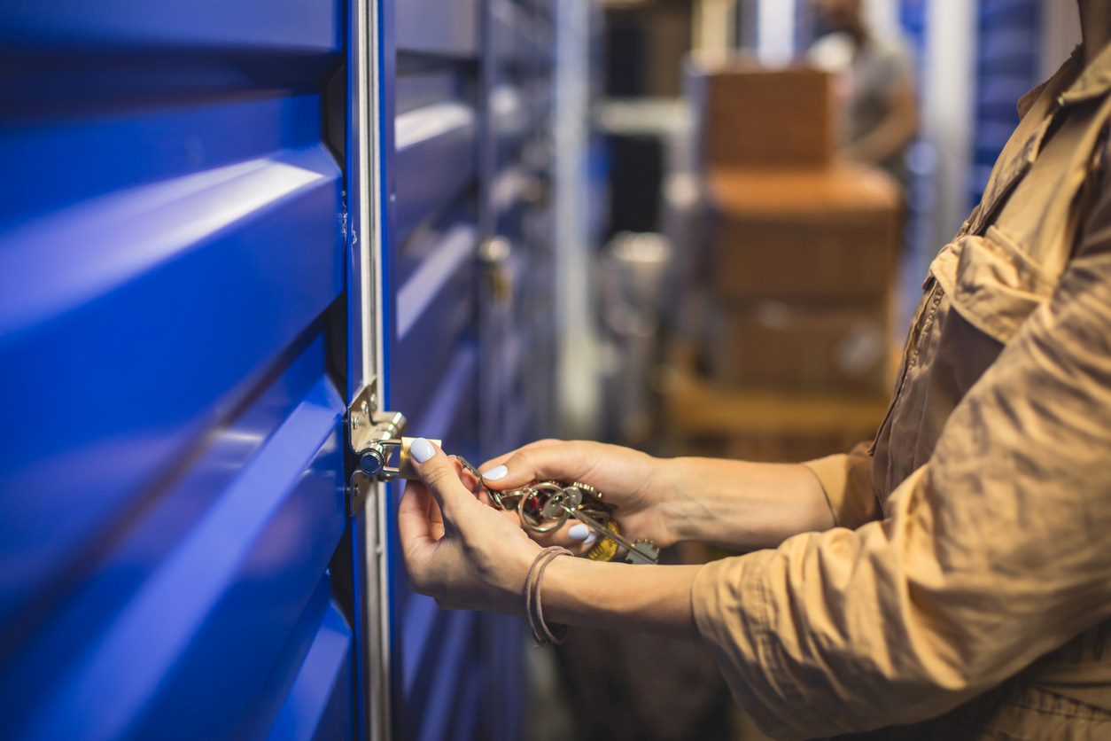 A woman opening her self storage unit.