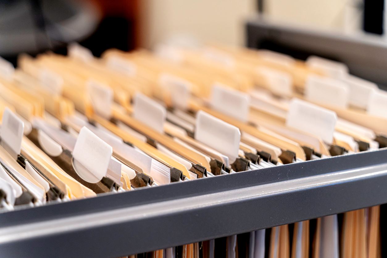 A close-up of hanging files in a file cabinet. 