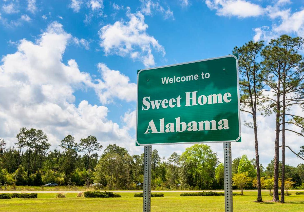 A shot of a green sign reading "Sweet Home Alabama."