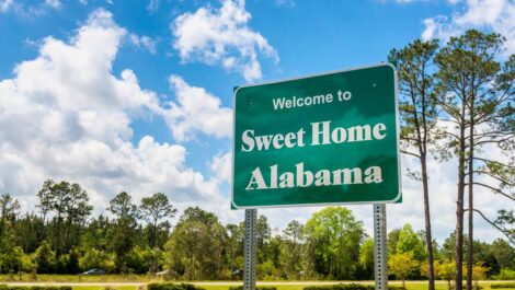 A shot of a green sign reading "Sweet Home Alabama."