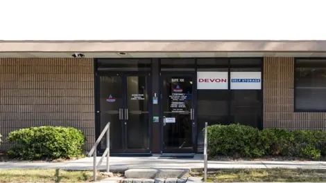 Parking lot of entrance to Devon Self Storage - Peachtree Corners