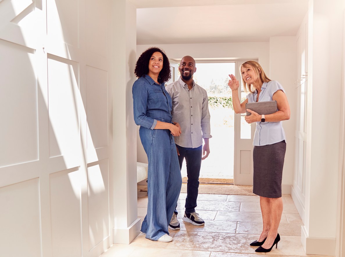 A couple tours a home they are interested in buying. 